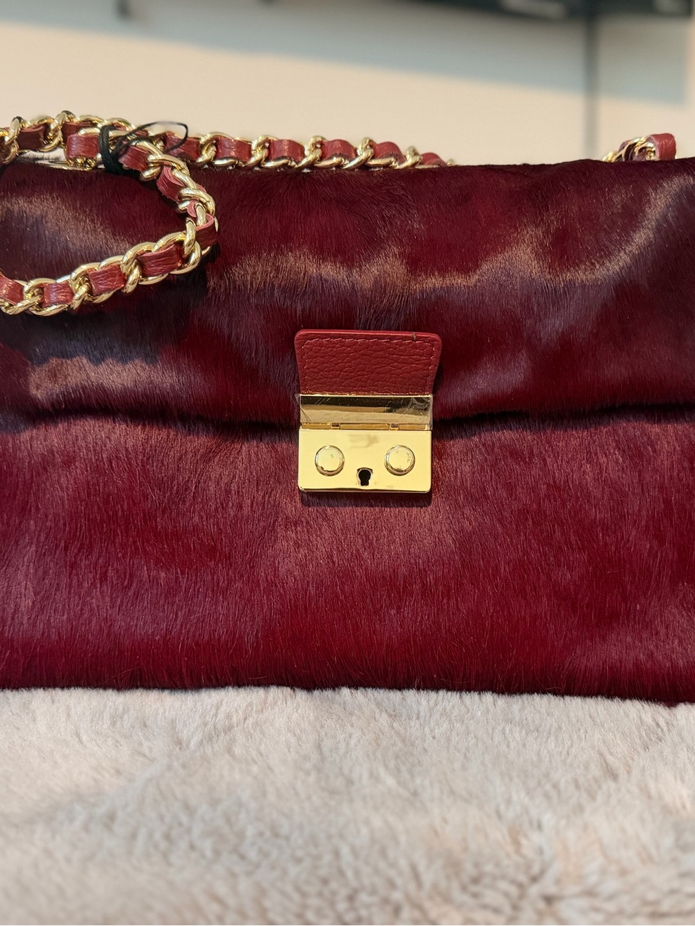 Plush Burgundy Shoulder Bag with Gold Chain Accent